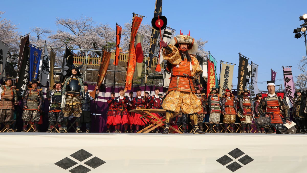 Performers in traditional samurai armor recreate a scene featuring Takeda Shingen during the annual Shingen-Ko Festival in Kofu