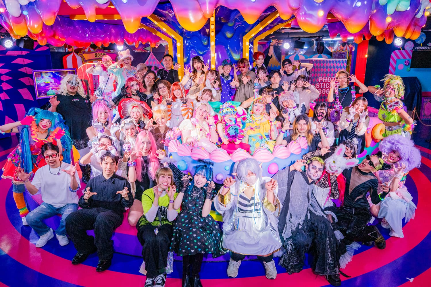 Guests in costume and performers gathered on the carousel stage at the KAWAII MONSTER HALLOWEEN 2026 opening party on 2026/10/03