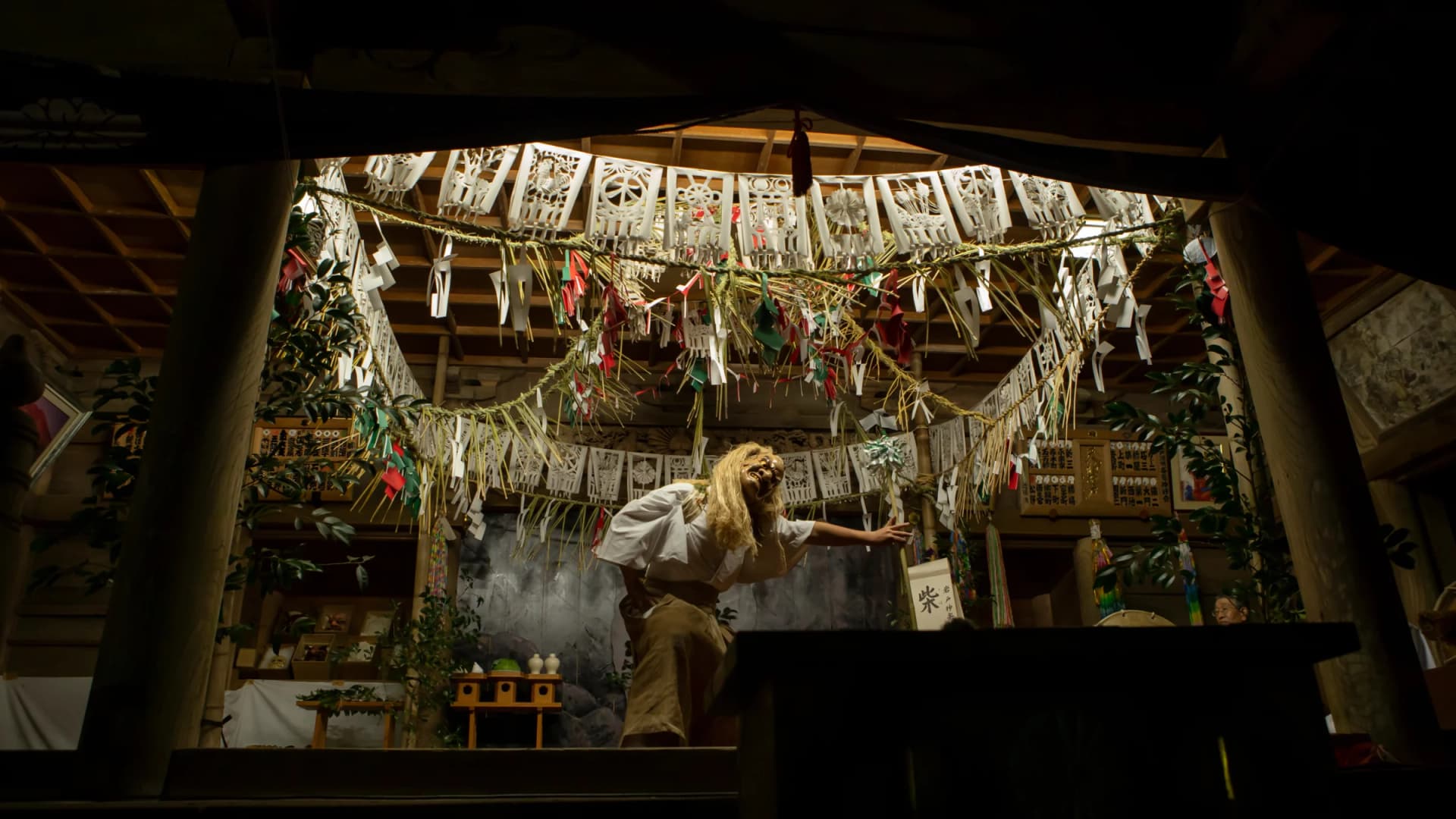 A dramatic tableau of Ame-no-Uzume's sacred dance illuminates the yokagura performance hall at Amano-Iwato Shrine, Takachiho