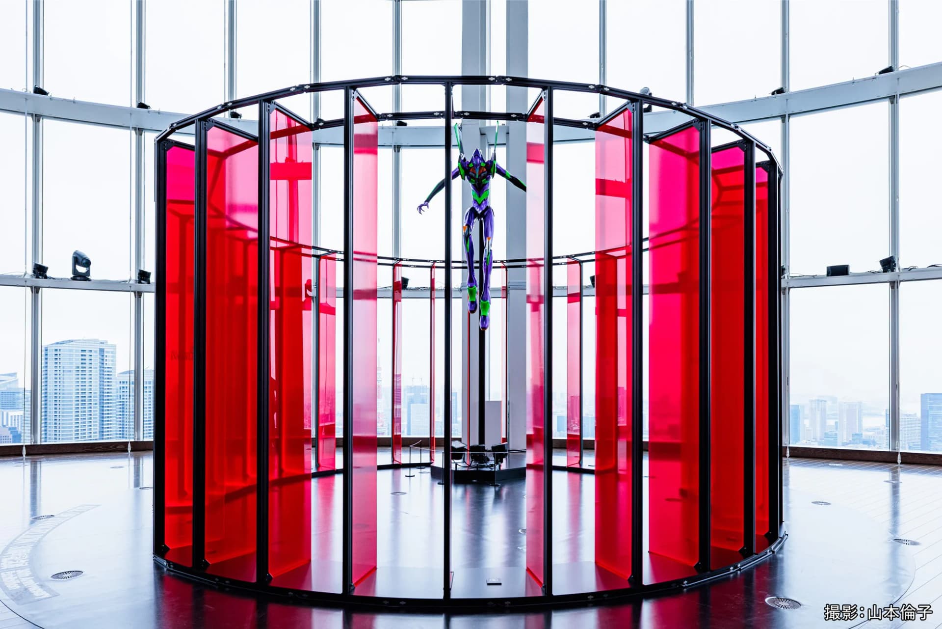 Eva Unit-01 suspended in a ring of red panels (Tokyo venue)