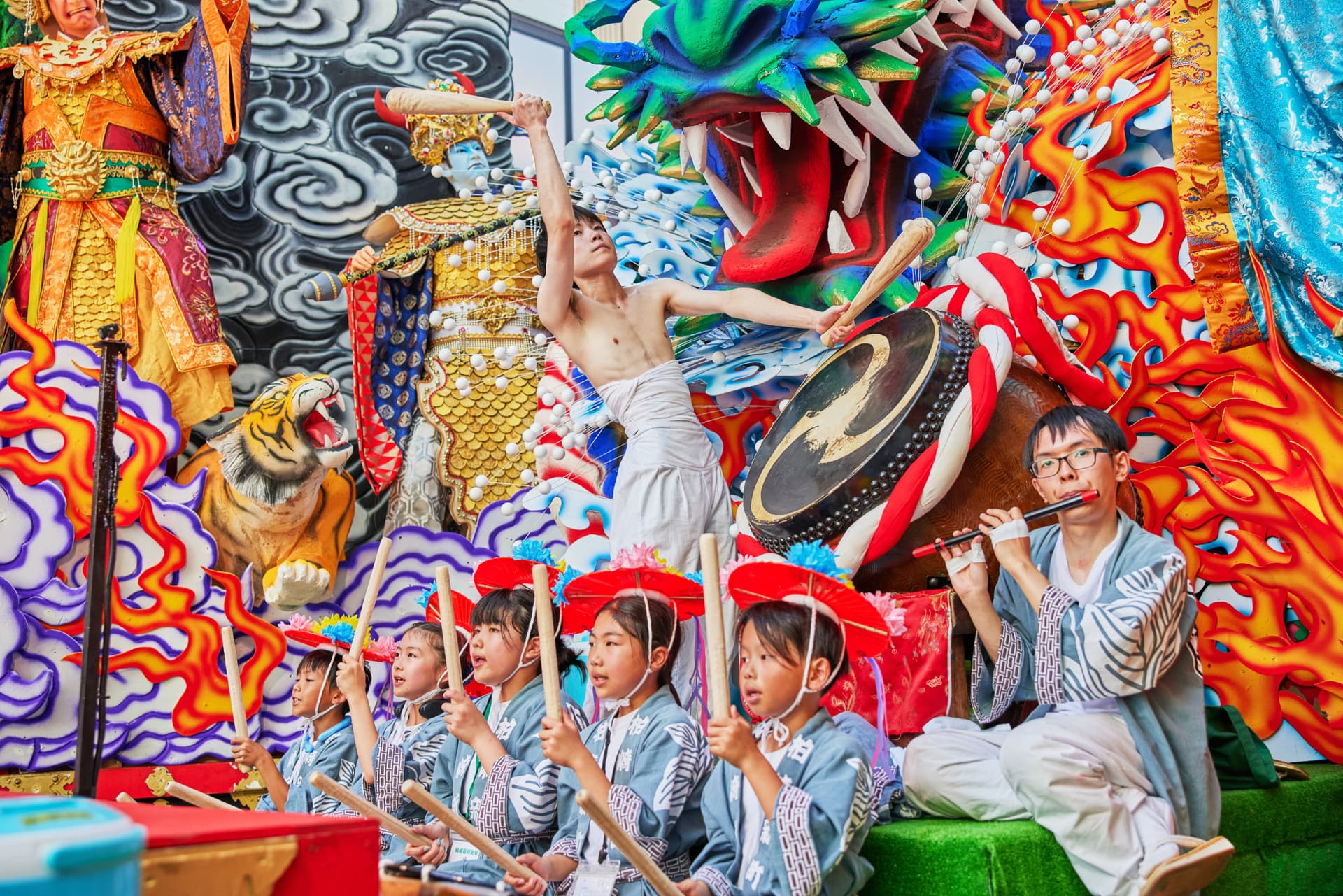 Taiko drumming and flute performances during the Hachinohe Sansha Taisai float parade