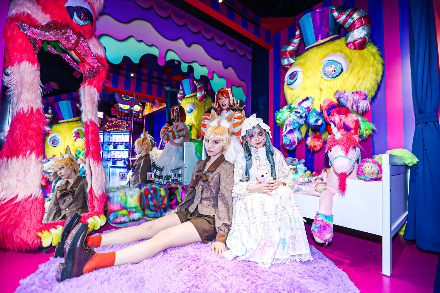 Guests in lolita dress and animal ears among giant furry monsters at KAWAII MONSTER LAND, KAWAII MONSTER HALLOWEEN 2026 opening party