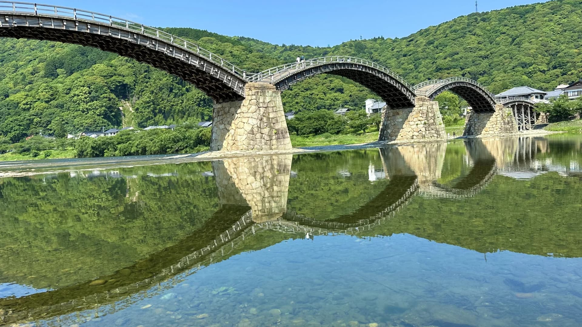 The five arches of Kintaikyo Bridge reflected in the Nishiki River, Yamaguchi