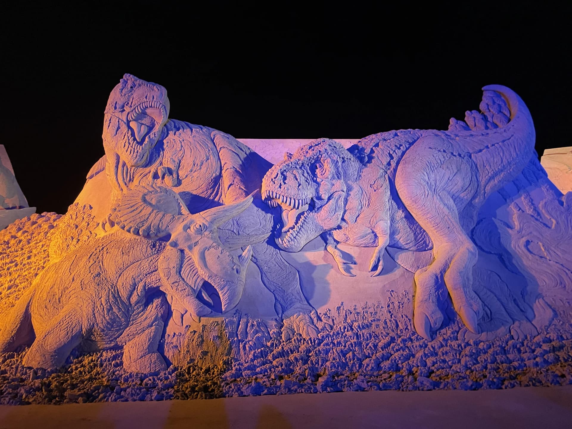 Ashiya Sand Craft Exhibition Tyrannosaurus and Triceratops sand sculpture at night, previous years' exhibition