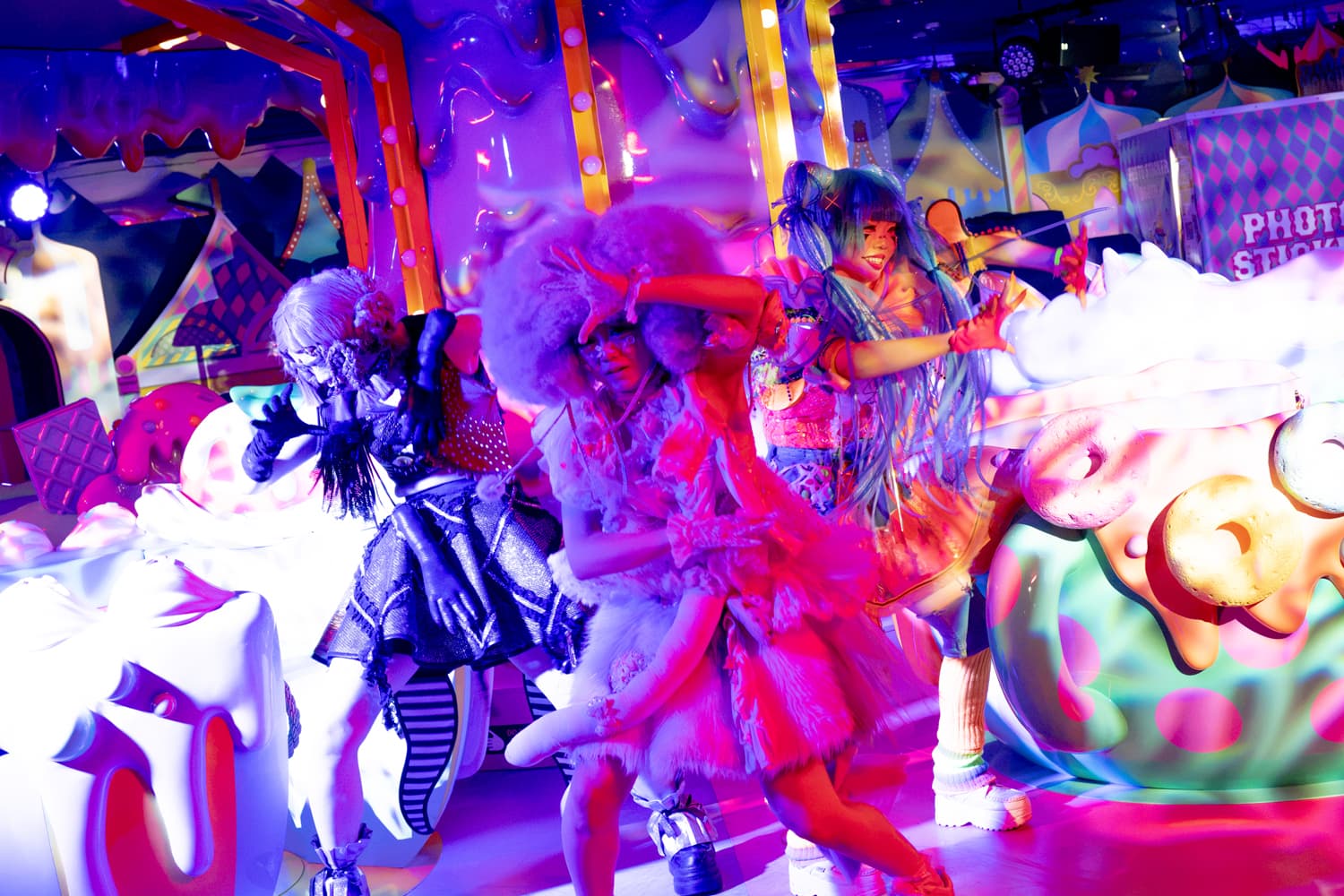 Performers in colorful wigs and costumes dancing at the KAWAII MONSTER HALLOWEEN 2026 opening party on 2026/10/03
