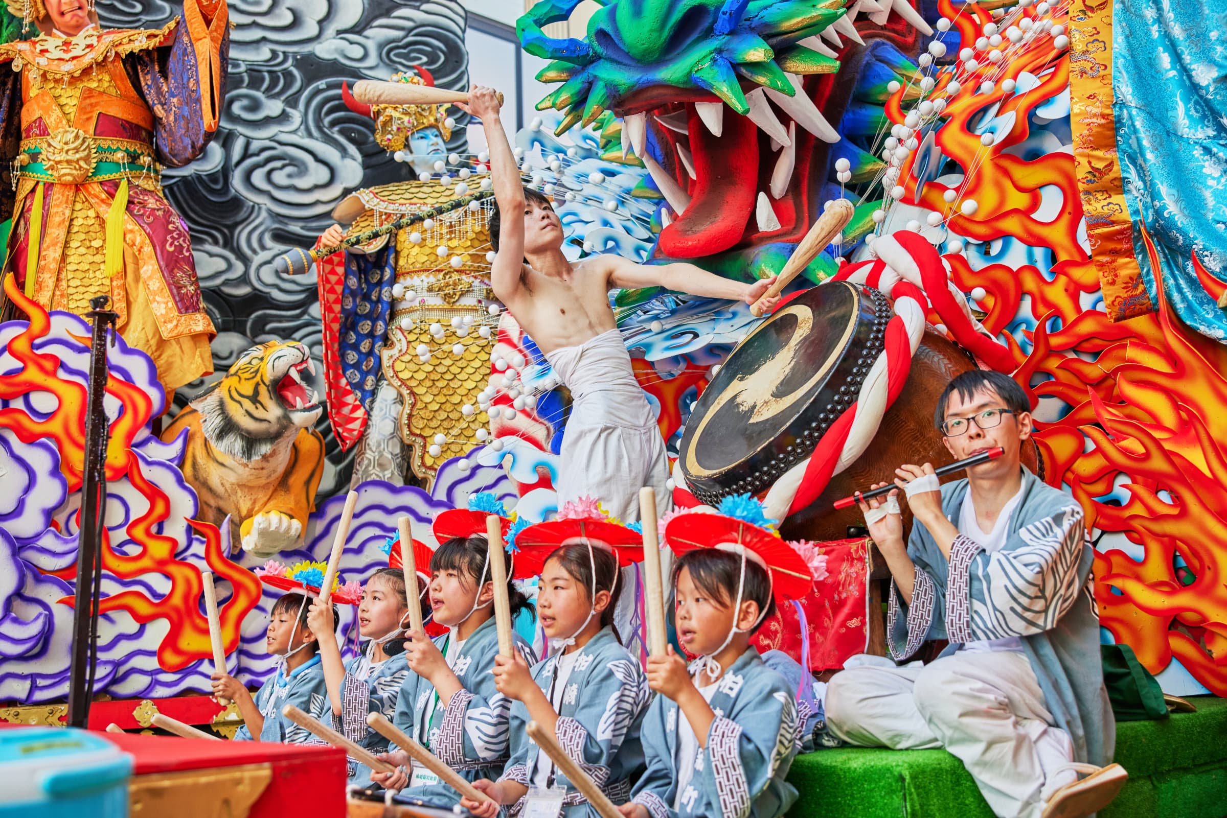 Taiko drumming and flute performances during the Hachinohe Sansha Taisai float parade