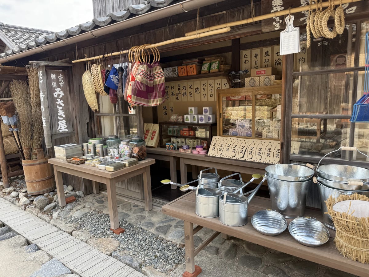 A recreated general store displaying everyday goods from the Showa era, from tabi socks and watering cans to confections and household sundries, at Twenty-Four Eyes Movie Village